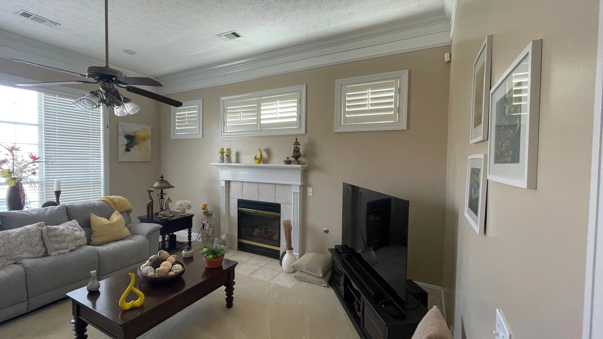 Living room with finished beige walls and white trim