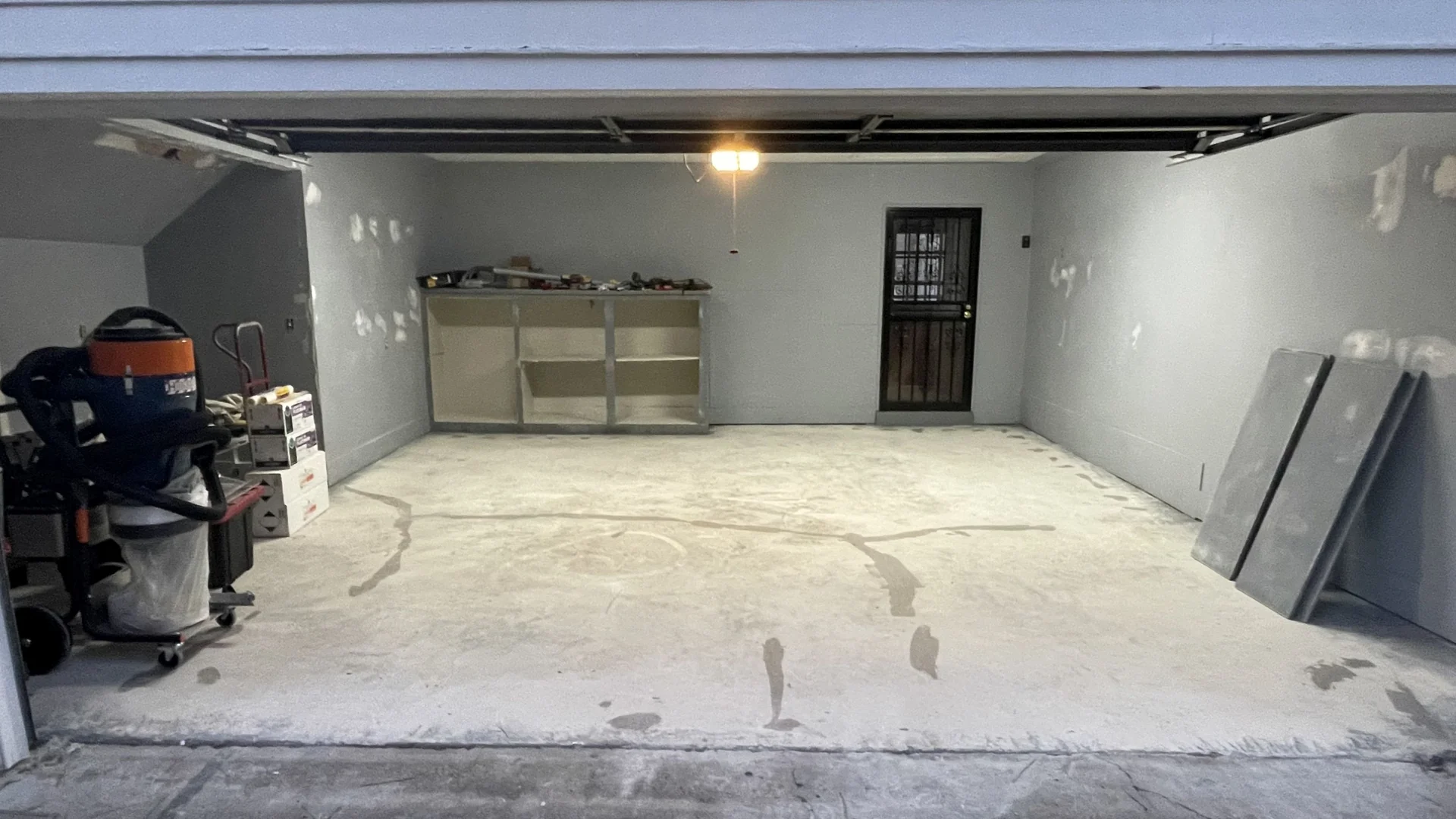 Garage slab with repaired cracks before coating