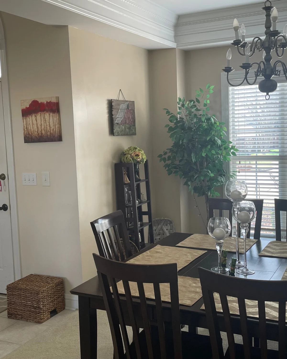 Dining room with light painted walls, white trim, and a dark dining table